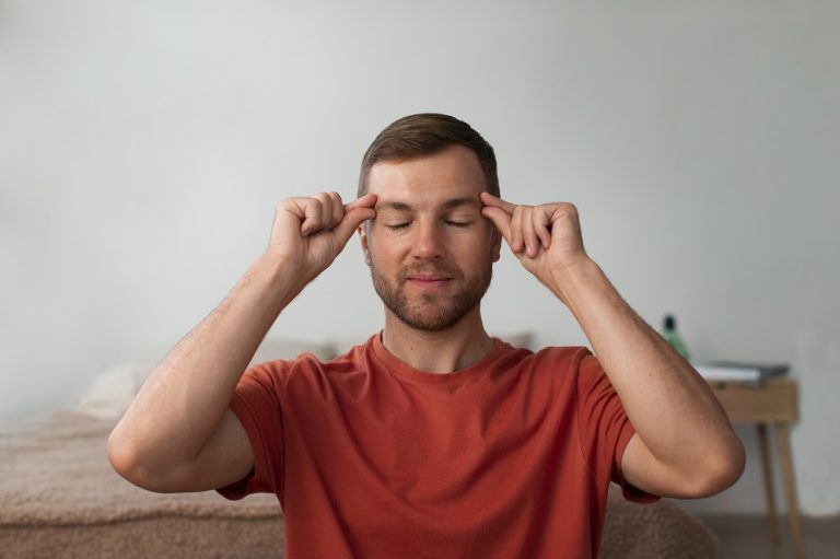 front-view-man-practicing-facial-yoga