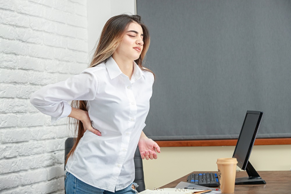 Young girl hurt her back because of sittin whole day